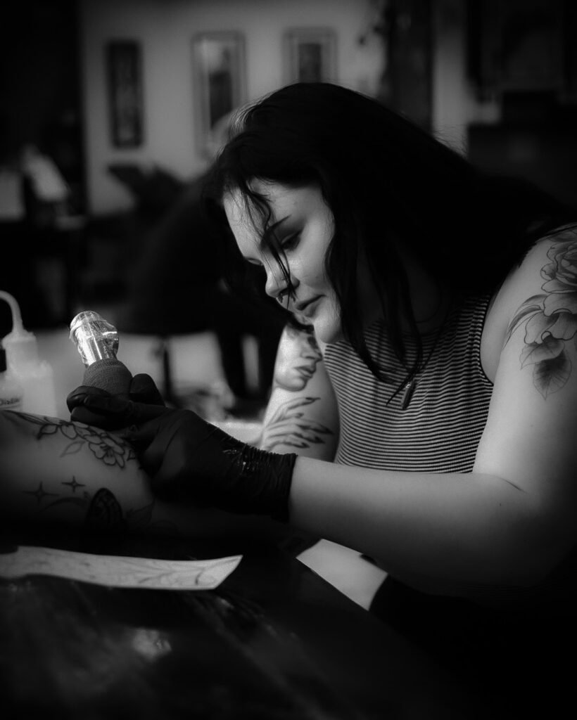 Tattoo Artist Savannah Layne working at Red Arbor Tattoo Shop