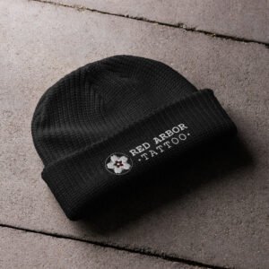 Red Arbor Fisherman Beanie – thick ribbed black knit hat with embroidered logo folded at cuff.